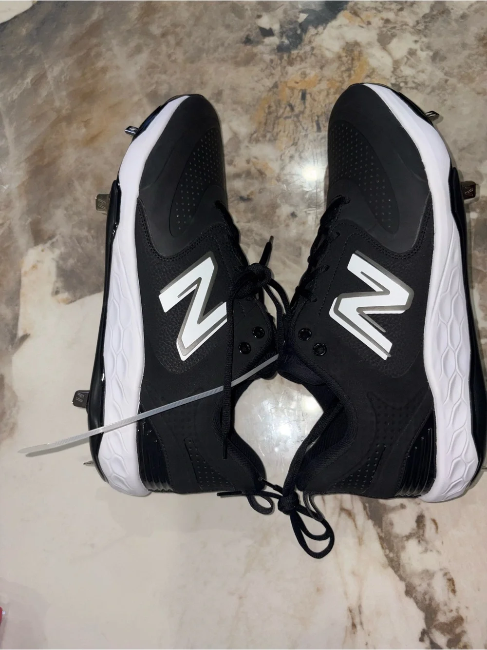 New Balance Men’s Black and White Baseball Cleats with Metal Spikes